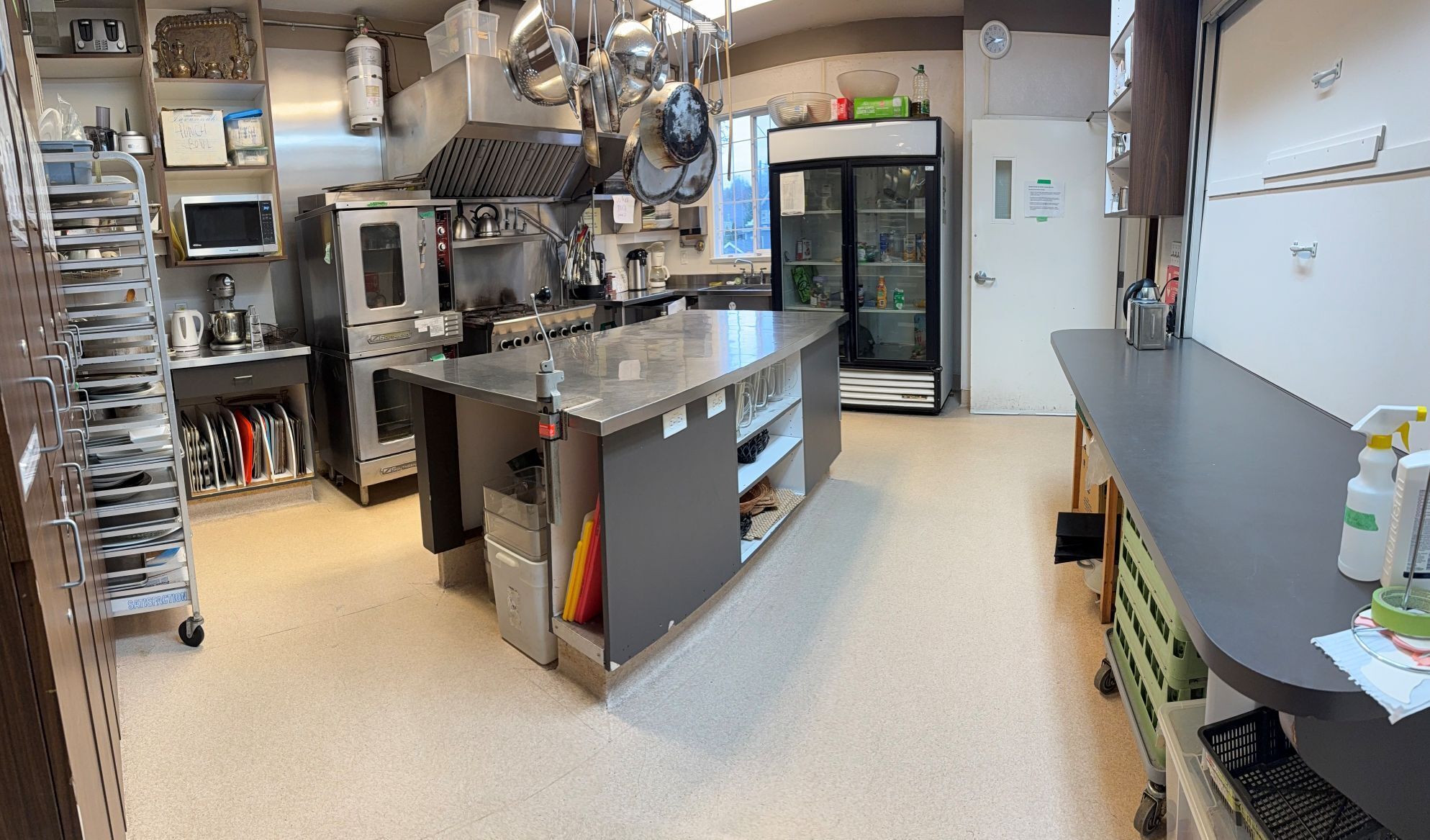 photo of our industrial kitchen with gas appliances and stainless steel counters
